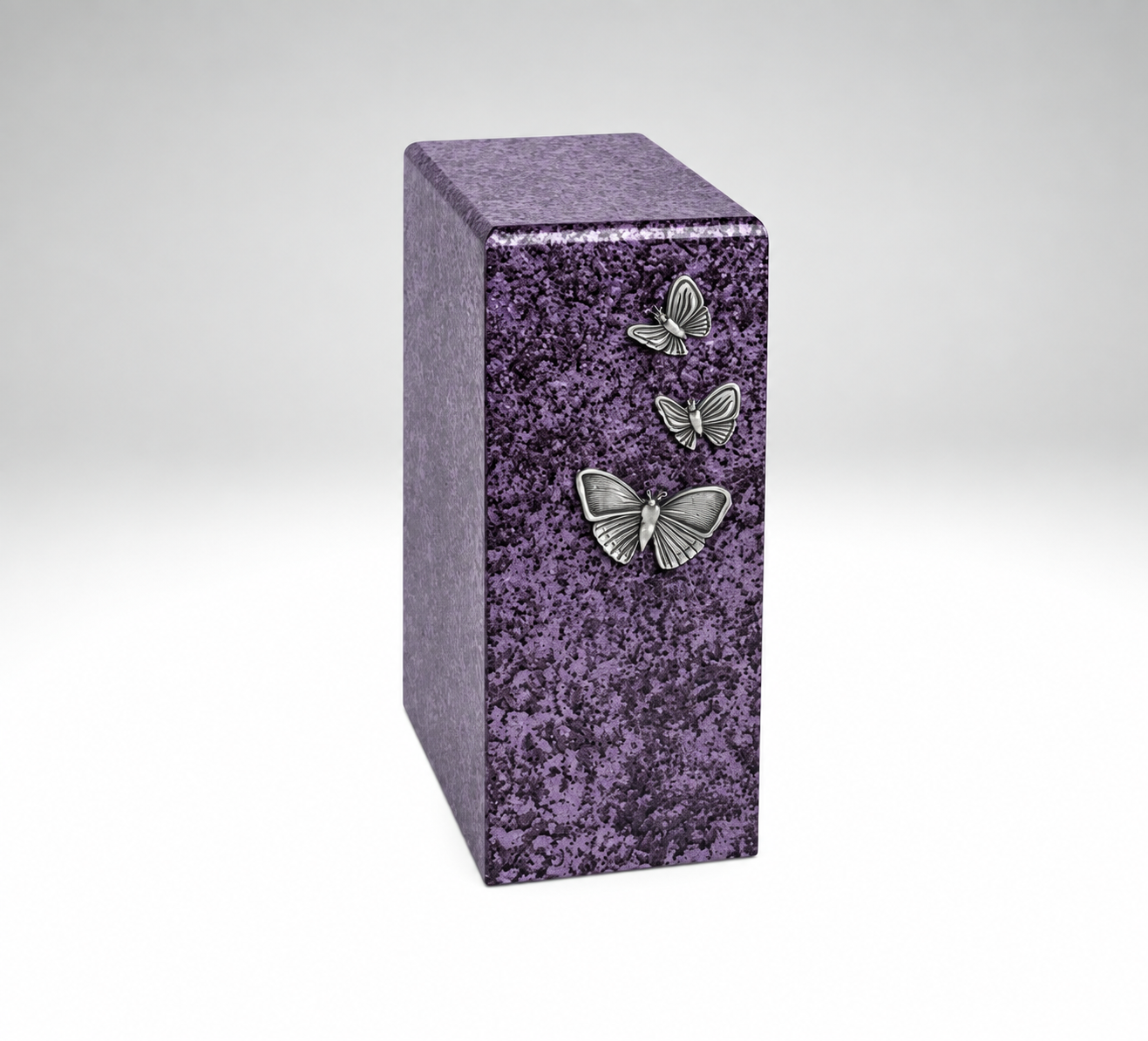 Purple single cremation urn with three silver butterflies